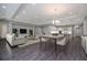 Open-concept living space featuring dining area, living room, and modern kitchen with pendant lighting at 6063 Dusk Rose Ln, Brooksville, FL 34601