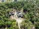 An overhead aerial view showcases home with pool and adjacent shed at 6080 Dexter Ln, Brooksville, FL 34602