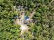 Overhead aerial view of the home, pool, shed and surrounding trees at 6080 Dexter Ln, Brooksville, FL 34602