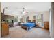 Spacious bedroom with vaulted ceiling, ceiling fan, and lots of light from the windows at 6080 Dexter Ln, Brooksville, FL 34602