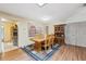 Cozy dining room featuring wood table, hutch, and a window with decorative curtains at 6080 Dexter Ln, Brooksville, FL 34602