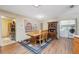 Cozy dining room features classic wooden furniture and direct access to a well-equipped laundry area at 6080 Dexter Ln, Brooksville, FL 34602