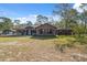 Charming single story home with a cozy front porch and well-maintained lawn in a tranquil setting at 6080 Dexter Ln, Brooksville, FL 34602
