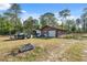 A detached garage and covered parking add to the property at 6080 Dexter Ln, Brooksville, FL 34602