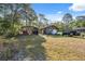 A detached garage and covered parking add to the property at 6080 Dexter Ln, Brooksville, FL 34602