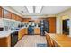 Spacious kitchen with stainless steel appliances, wood cabinets, and wood-look flooring at 6080 Dexter Ln, Brooksville, FL 34602