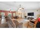 Spacious living room with ceiling fan, television, and comfortable furniture at 6080 Dexter Ln, Brooksville, FL 34602