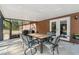 Covered patio area with outdoor table and chairs and a view of the backyard at 6080 Dexter Ln, Brooksville, FL 34602