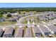Aerial view of a neighborhood with ponds, mature trees and landscaping, and single-Gathering homes at 6561 Seaway Dr, Brooksville, FL 34604