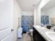 Bright bathroom with granite countertops, tiled floor, a shower and a sink at 6561 Seaway Dr, Brooksville, FL 34604