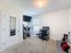 Bright bedroom area showing a study desk and large television at 6561 Seaway Dr, Brooksville, FL 34604