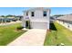 Two-story home with a two-car garage, manicured lawn and landscaping at 6561 Seaway Dr, Brooksville, FL 34604