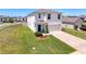 Two-story home with a two-car garage, manicured lawn and landscaping at 6561 Seaway Dr, Brooksville, FL 34604