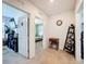 Inviting hallway featuring neutral carpets and décor with open doorway to bedroom area at 6561 Seaway Dr, Brooksville, FL 34604