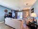 Open living room, with ceiling fan and sliding glass door to backyard at 6561 Seaway Dr, Brooksville, FL 34604