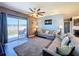 Open living room with sliding glass door to backyard at 6561 Seaway Dr, Brooksville, FL 34604