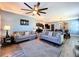 Living room with ceiling fan and open view to kitchen and dining at 6561 Seaway Dr, Brooksville, FL 34604