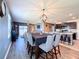 Open floor plan seamlessly connects dining, kitchen, and living areas, bathed in natural light at 6561 Seaway Dr, Brooksville, FL 34604