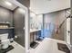 Elegant main bathroom with dual sinks, sleek fixtures, and glass enclosed shower at 6561 Seaway Dr, Brooksville, FL 34604