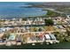 Aerial view of a coastal neighborhood with waterfront homes and canals at 6622 Seaview Blvd, Hudson, FL 34667