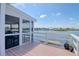 Relaxing screened deck overlooking the water, perfect for enjoying serene views and outdoor living at 6622 Seaview Blvd, Hudson, FL 34667