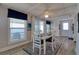 Cozy dining room with waterfront view, a classic white table, and blue accents at 6622 Seaview Blvd, Hudson, FL 34667