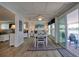 Charming dining area featuring waterfront views and stylish nautical decor, seamlessly flowing to outdoor deck at 6622 Seaview Blvd, Hudson, FL 34667