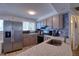 Functional kitchen features stainless steel appliances and sleek countertops at 6622 Seaview Blvd, Hudson, FL 34667