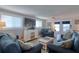Comfortable living room with plentiful seating and a view of the waterfront at 6622 Seaview Blvd, Hudson, FL 34667
