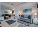 Cozy living area featuring a comfortable sofa, stylish decor, and plenty of natural light at 6622 Seaview Blvd, Hudson, FL 34667
