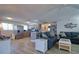 Open-concept living space featuring a kitchen, and a comfortable living area with stylish furnishings at 6622 Seaview Blvd, Hudson, FL 34667