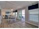 Inviting living space with dining area, natural light, and sliding doors to a waterfront deck at 6622 Seaview Blvd, Hudson, FL 34667
