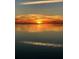 Waterfront landscape displaying stunning sunset over water at 6622 Seaview Blvd, Hudson, FL 34667