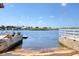 Picturesque waterfront view from the backyard with lush greenery and a dock at 6622 Seaview Blvd, Hudson, FL 34667