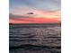 Calming waterfront view at dusk with vibrant pink and orange sky at 6622 Seaview Blvd, Hudson, FL 34667