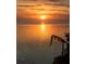 Scenic image of golden sunset reflecting over a serene waterfront, creating a tranquil ambiance at 6622 Seaview Blvd, Hudson, FL 34667