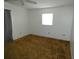 This cozy bedroom features a large window and neutral colored walls at 6636 Timbercove Ln # 6636, New Port Richey, FL 34653