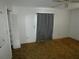 Cozy bedroom with carpet flooring, a window with curtains, and a closet at 6636 Timbercove Ln # 6636, New Port Richey, FL 34653