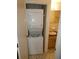 Bathroom with a stackable washer and dryer set inside a closet near the sink at 6636 Timbercove Ln # 6636, New Port Richey, FL 34653