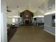 Expansive meeting room with a brick fireplace, ample seating, and access to a kitchen, perfect for community gatherings at 6636 Timbercove Ln # 6636, New Port Richey, FL 34653