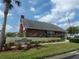Exterior view of The Wilds Recreation Center with lush landscaping at 6636 Timbercove Ln # 6636, New Port Richey, FL 34653