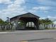 External view of a covered bridge on a sunny day with a street in front at 6636 Timbercove Ln # 6636, New Port Richey, FL 34653