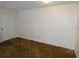A small room featuring carpet and a white door leading outside at 6636 Timbercove Ln # 6636, New Port Richey, FL 34653