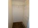 Walk-in closet featuring white walls, carpet flooring, and wire shelving for storage at 6636 Timbercove Ln # 6636, New Port Richey, FL 34653