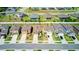Aerial view of homes in a suburban neighborhood featuring manicured lawns and concrete driveways at 680 Argyll Dr, Spring Hill, FL 34609