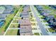 An elevated neighborhood view with modern homes, landscaped front yards, and backyard spaces at 680 Argyll Dr, Spring Hill, FL 34609