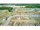 A clear shot of the property line in a neat, modern neighborhood surrounded by lush greenery and community charm at 680 Argyll Dr, Spring Hill, FL 34609