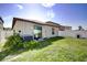 Backyard featuring a fenced-in yard, patio, and well-maintained lawn at 680 Argyll Dr, Spring Hill, FL 34609