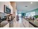 Modern kitchen with white cabinetry, granite countertops, stainless steel appliances, and open to the living space at 680 Argyll Dr, Spring Hill, FL 34609