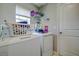 Functional laundry room with modern appliances and convenient storage space at 680 Argyll Dr, Spring Hill, FL 34609